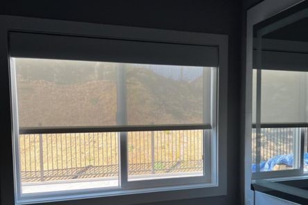 Kitchen view showing high quality pull down window shade in sheer fabric, giving the room a clean, contemporary look.